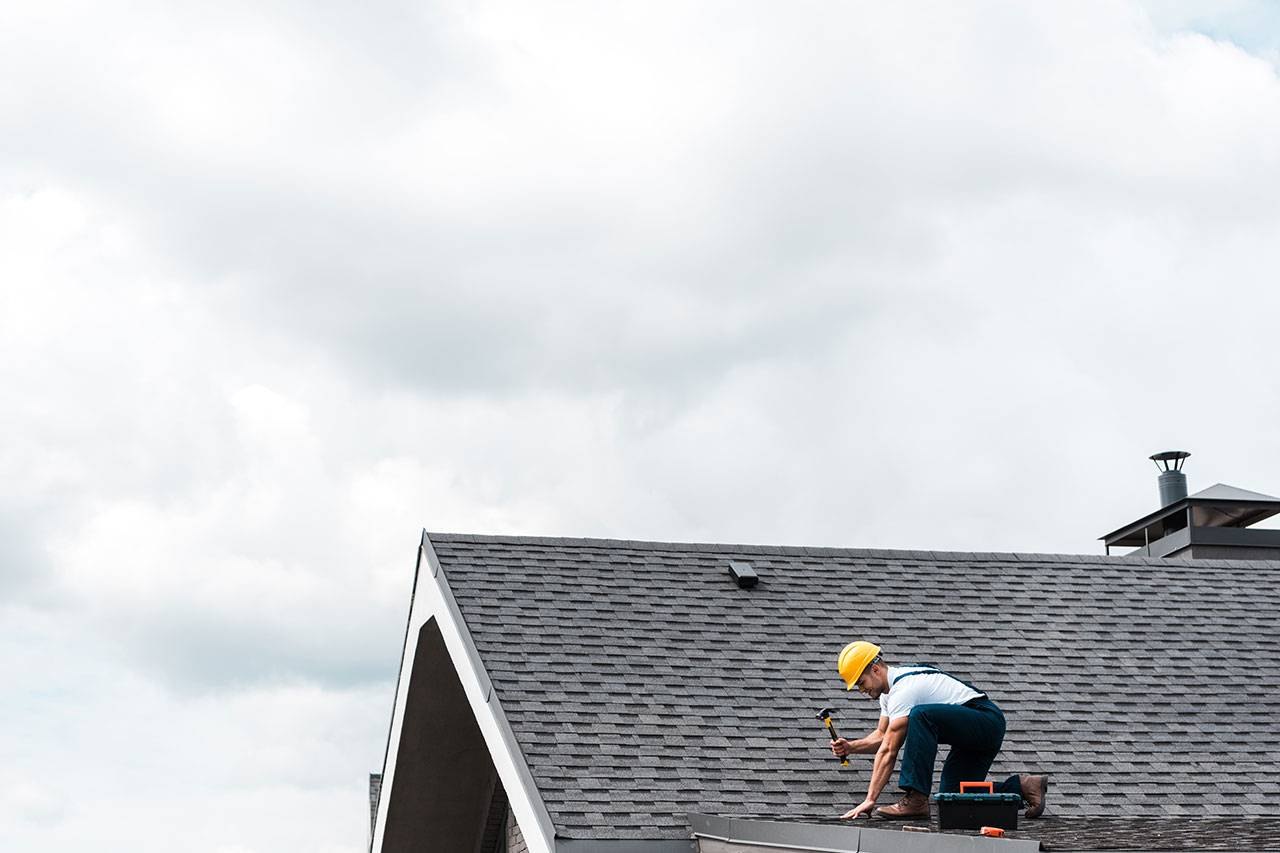 repairman-in-helmet-holding-hammer-while-repairing-2022-11-02-03-50-58-E2M98F8